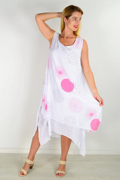 Pink spot sleeveless tunic dress by La Mode displayed on a hanger with a simple background