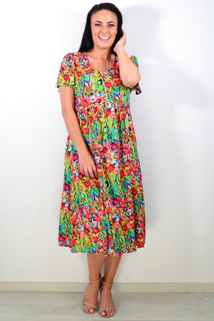Hourglass Poppy Field Tunic Dress, lightweight tunic with floral print, flowing fabric, and relaxed fit, displayed on a hanger.