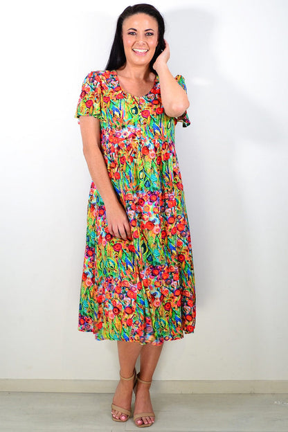 Hourglass Poppy Field Tunic Dress, lightweight tunic with floral print, flowing fabric, and relaxed fit, displayed on a hanger.