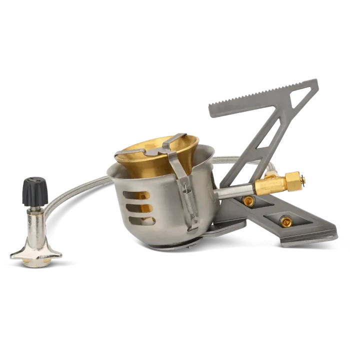 Primus Expedition Multifuel Stove with pot legs collapsed for packing on a white background
