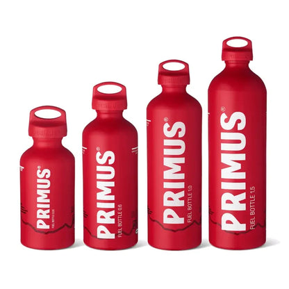Set of red Primus fuel bottles in the four different sizes on a white background