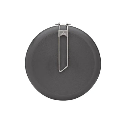 Base of the small Primus Litech frying pan with the handle folded flat on a white background