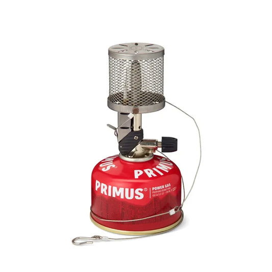 Primus Micron stainless steel lantern  with a power gas fuel canister and hanging line on a white background
