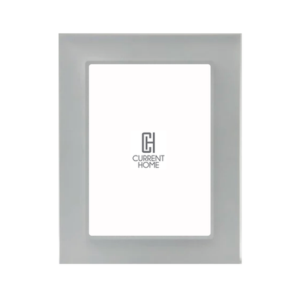 The Bella Moulding Prisma Frame Smoke is a modern acrylic picture frame with a smooth, light gray border and UV-filtering glass to protect your artwork. It features a white placeholder with the Current Home logo in the center.
