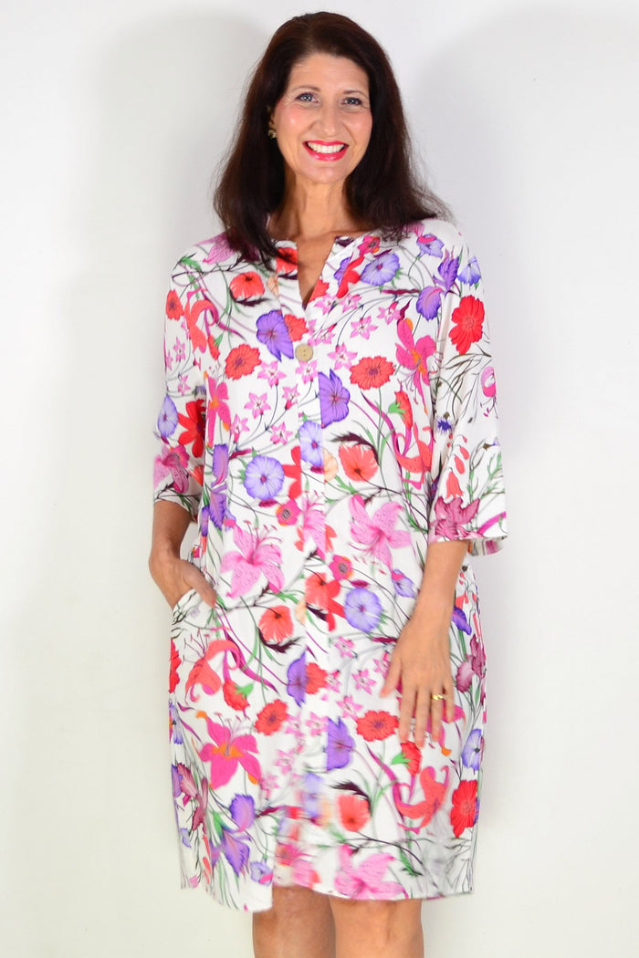 Purple pink floral linen blend tunic by La Mode, featuring a lightweight, flowy fabric with a relaxed fit and vibrant floral pattern.