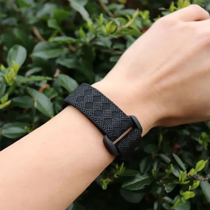 person Pyramid DEET Mosquito Repellent Wrist Band with a bush background