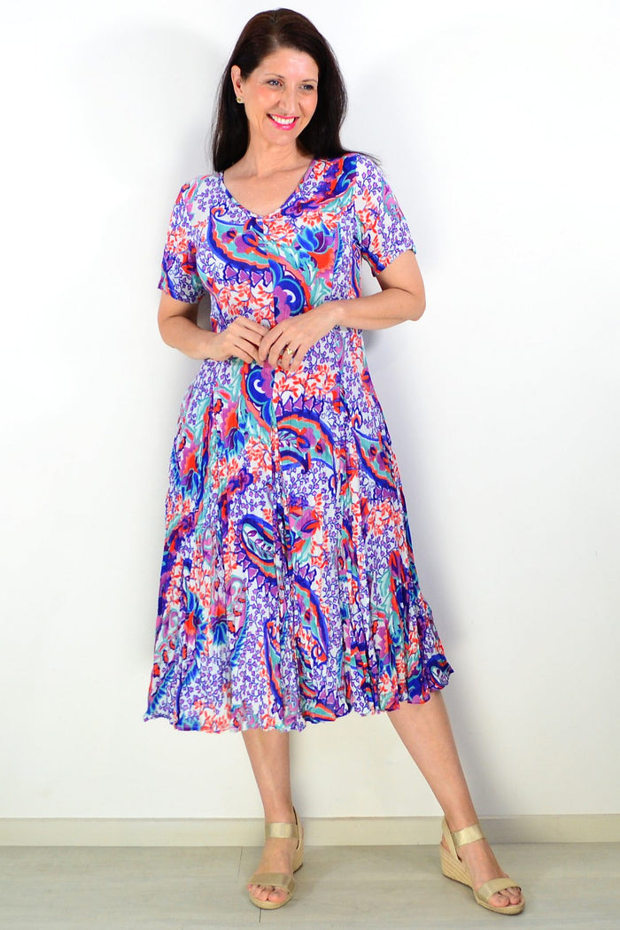 Orientique Radhanagar short sleeve godet tunic dress in lightweight fabric, displayed on a hanger with detailed design visible.