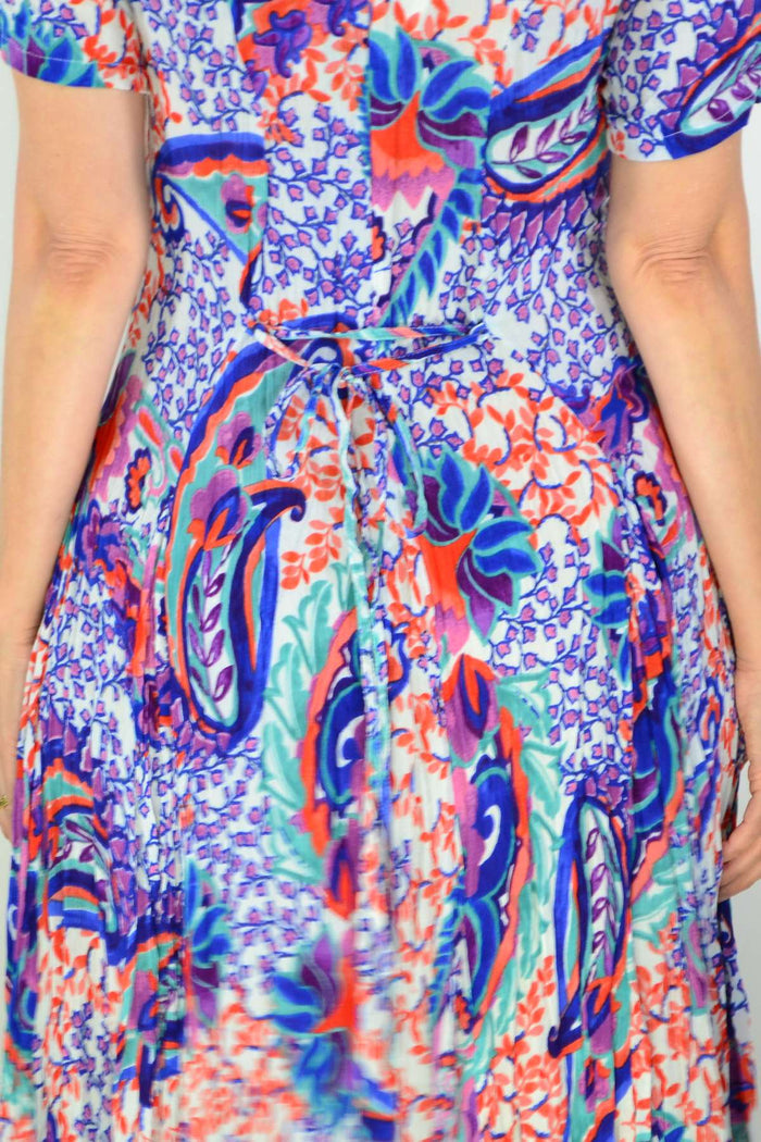 Back view of Orientique Radhanagar short sleeve godet tunic dress with flowing fabric and relaxed fit, perfect for casual wear.