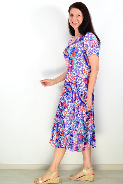 Orientique Radhanagar short sleeve godet tunic dress with flowy fabric and vibrant pattern, perfect for casual or summer wear.