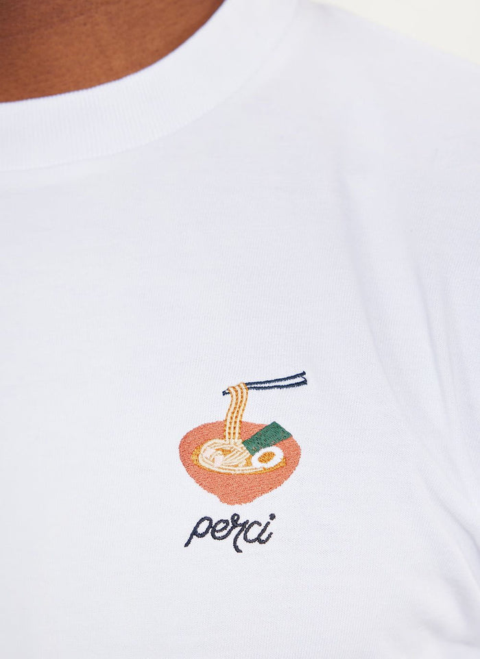 Close-up of the ramen embroidery on the white organic cotton Percival t-shirt.
