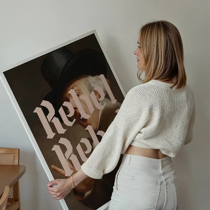 Rebel Rebel Typography Print held up against a living room wall
