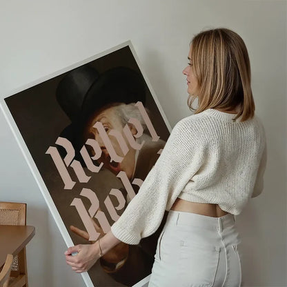 Rebel Rebel Typography Print held up against a living room wall