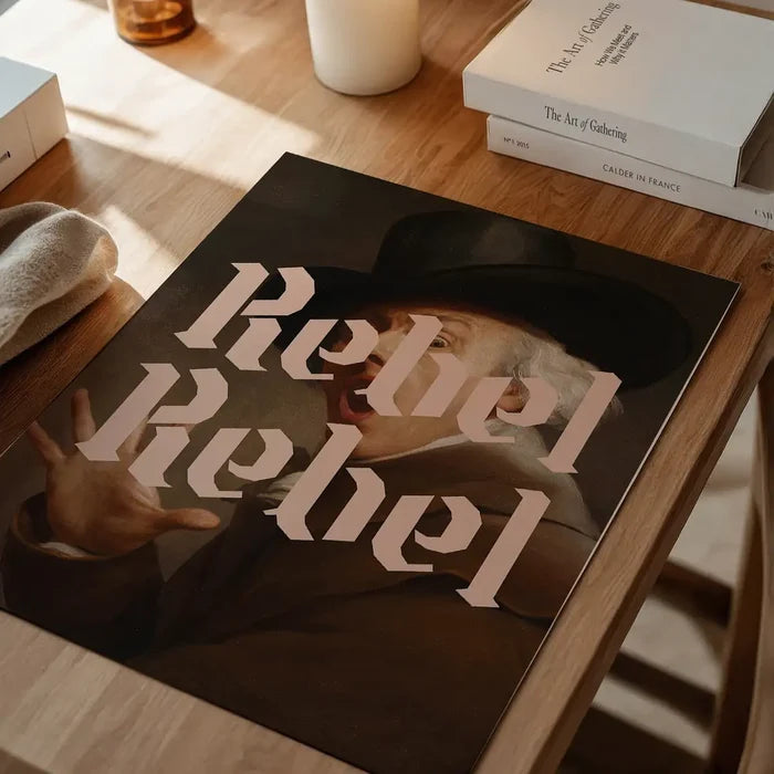 Rebel Rebel Typography Print, quirky altered art print unframed on a home office desk