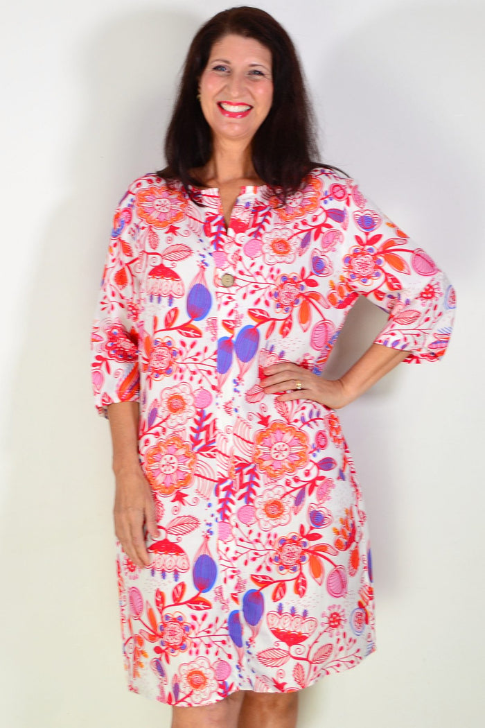 Red floral linen blend tunic by La Mode featuring a relaxed fit and vibrant floral pattern, shown on a model.