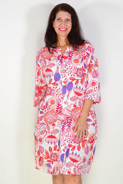 Red floral linen blend tunic by La Mode, featuring a relaxed fit with vibrant floral patterns, perfect for casual wear.