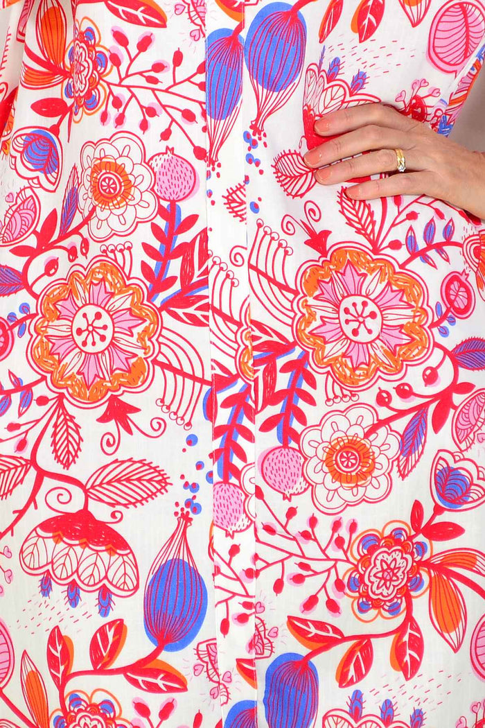 Red floral linen blend tunic by La Mode, featuring a relaxed fit with a vibrant floral pattern and lightweight fabric.