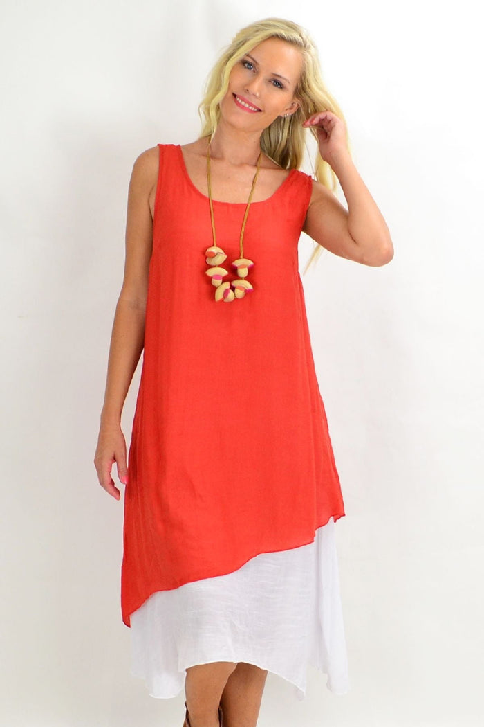 Rust asymmetrical hem tunic dress by Missy Q, featuring a flowy silhouette and stylish, uneven hemline for a modern look.