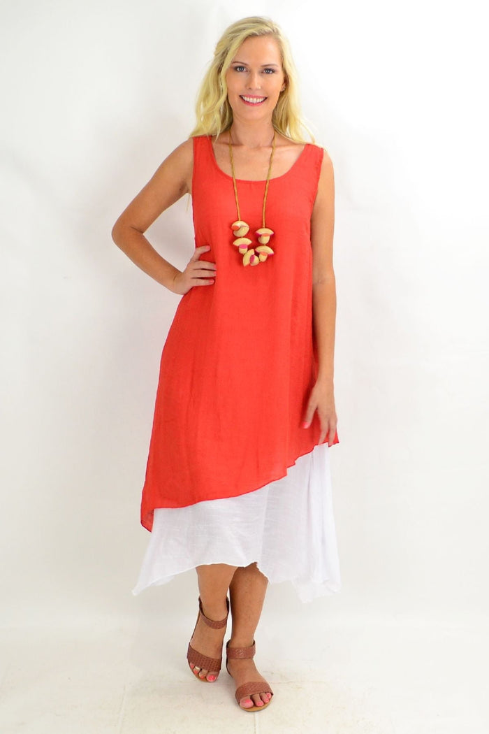 Rust asymmetrical hem tunic dress by Missy Q, showcasing lightweight fabric, relaxed fit, and stylish hemline details.