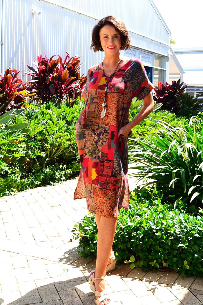 Rust orange playful tunic dress by Hourglass, showcasing a relaxed fit and stylish design, perfect for casual wear.