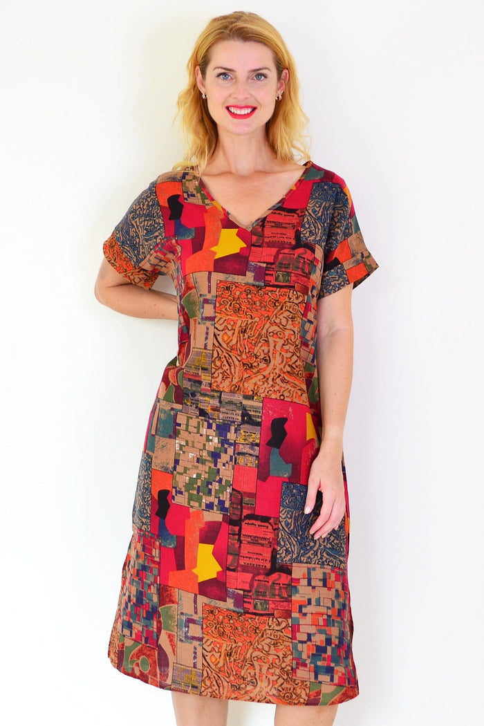 Rust orange Hourglass playful tunic dress displayed with a relaxed fit and playful design, ideal for casual or stylish wear.