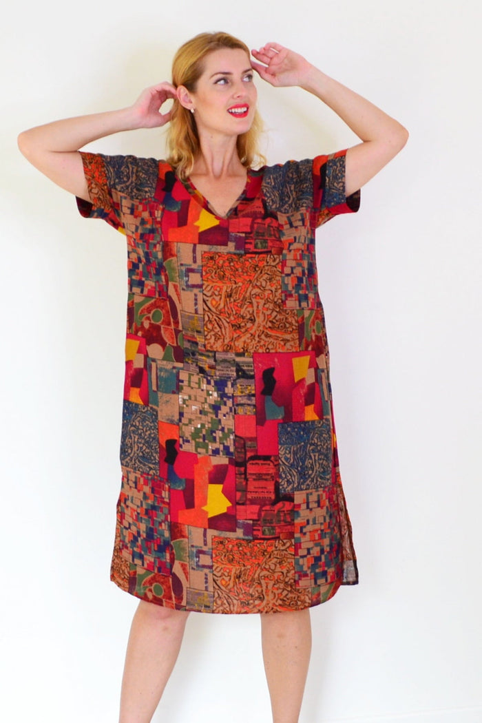 Rust orange Hourglass playful tunic dress with a relaxed fit, featuring a flowing silhouette and casual style.