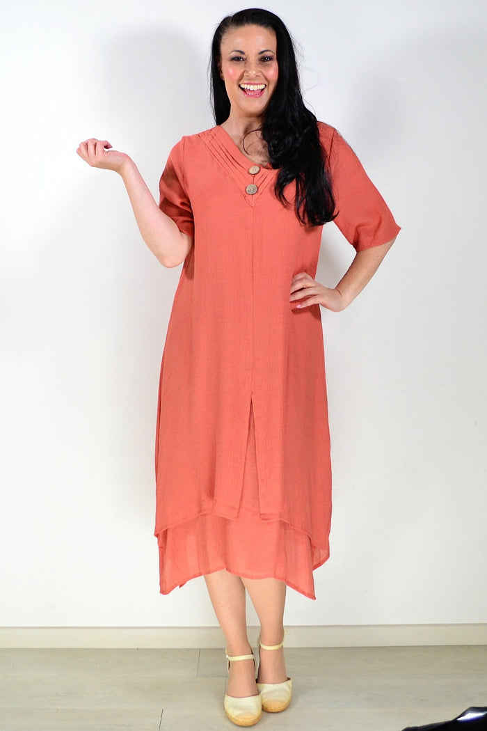 Rust-colored La Mode summer tunic dress with short sleeves and a relaxed fit, displayed on a hanger.