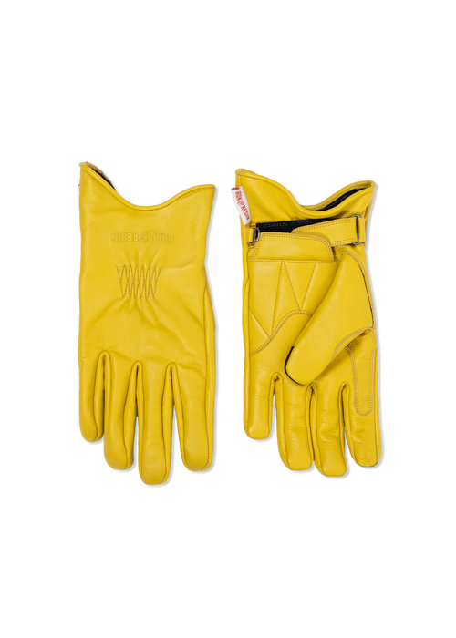 Yellow leather gloves, one palm up and one down, showing stitching detail and adjustable wrist strap against a white background.