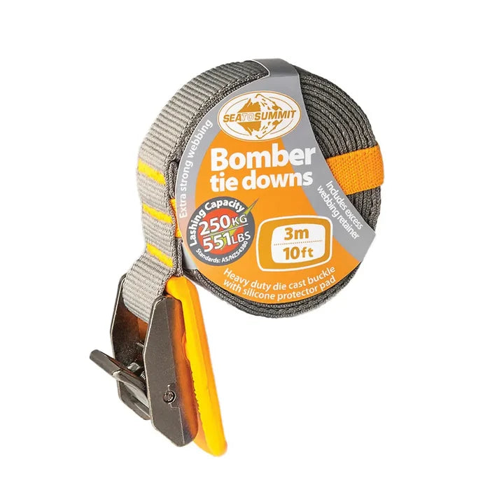 Sea To Summit 3 metre orange coloured Bomber Tie Down Strap coiled showing the silcone protection pad on a white background