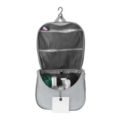 Sea To Summit Hanging Toiletry Bag Large in grey with the lid open to show the hanging  bar on a white background