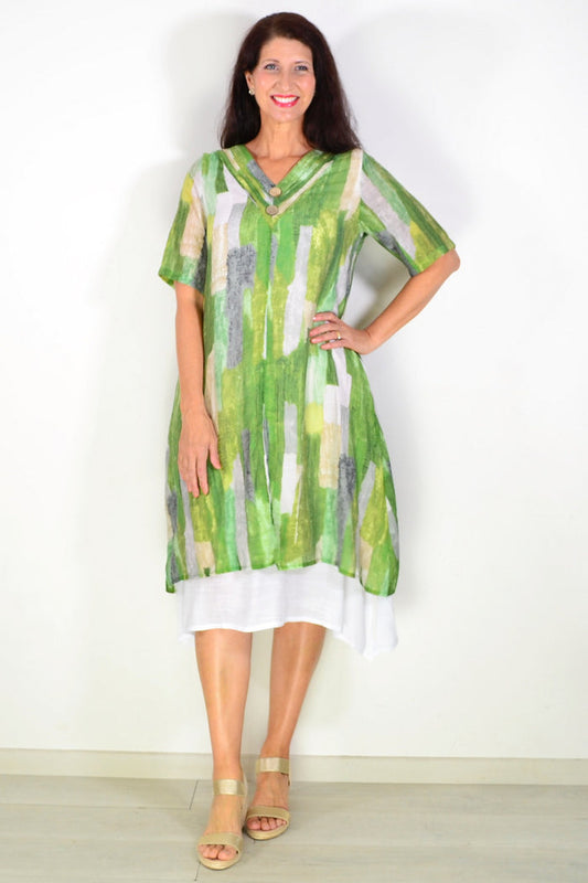 La Mode Shades of Green summer tunic dress with a flowing fabric and vibrant green patterns, worn on a model.