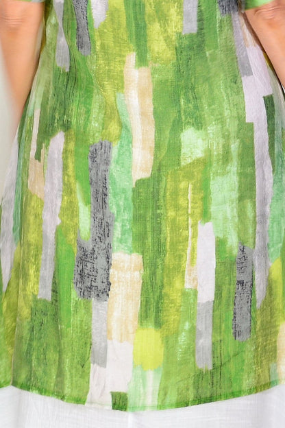 Green summer tunic dress by La Mode featuring a lightweight, flowing fabric and a relaxed fit, perfect for warm weather.