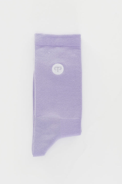 Purple sock with a logo on a light gray background