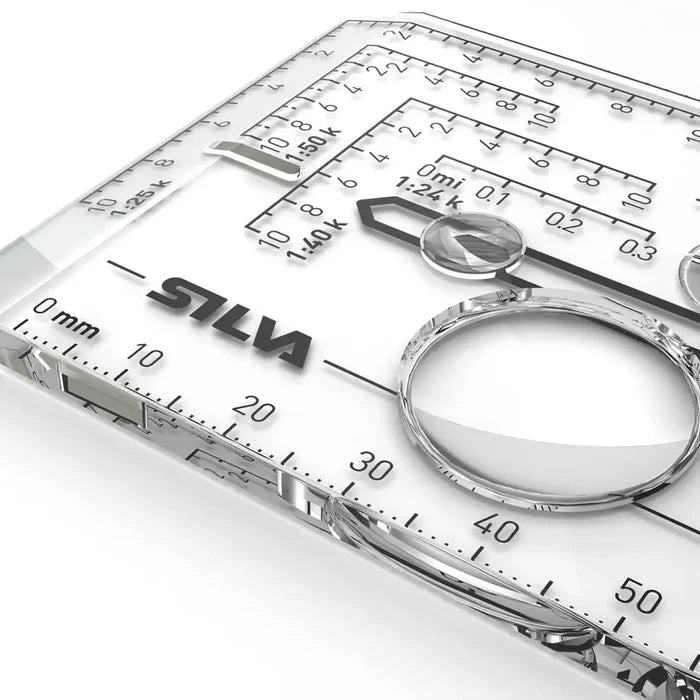 Magnification lens es and scale marcers on the acrylic baseplate of a Silva Expedition compass