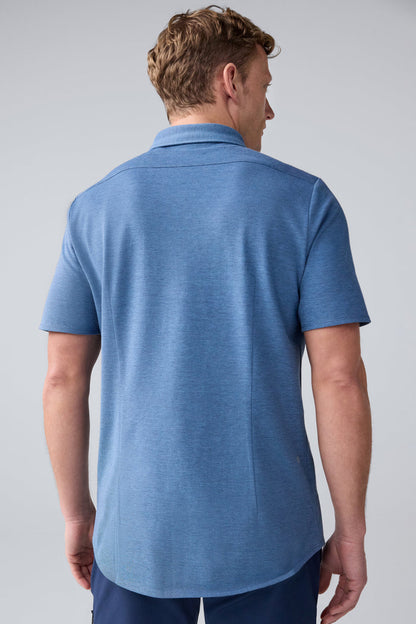 Back view of a man wearing SILVER Pique Short Sleeve Button Up in Total Eclipse Chambray Oxford
