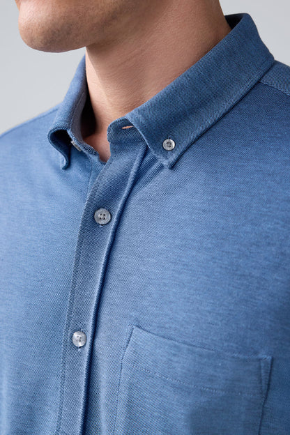 Detailed view of a man wearing SILVER Pique Short Sleeve Button Up in Total Eclipse Chambray Oxford