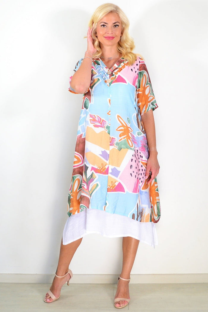 Sky blue floral print summer tunic dress by La Mode, featuring a flowy fabric and vibrant floral pattern.