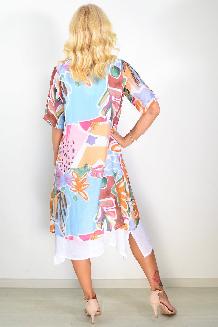 Sky blue floral print summer tunic dress by La Mode, lightweight fabric, flowing fit, showcasing a vibrant floral pattern.