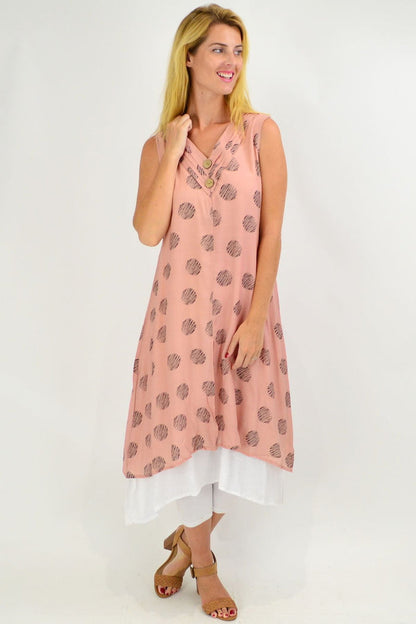 Sleeveless dusty pink tunic dress with black dot overlay by La Mode, cotton fabric, showcasing a relaxed fit and stylish design.