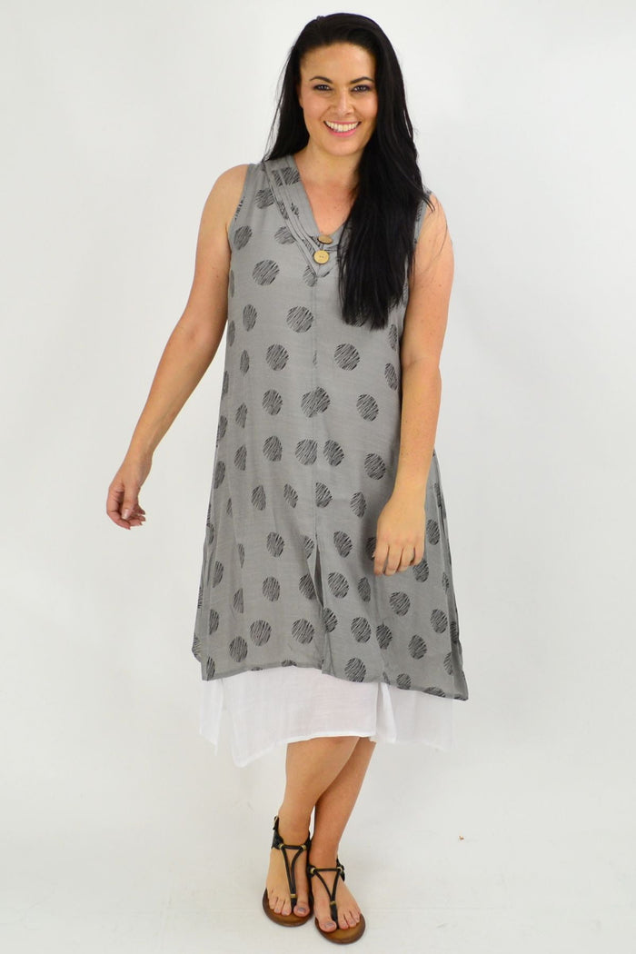 Sleeveless grey dots overlay tunic dress by La Mode, featuring a relaxed fit and stylish dotted pattern, displayed on a hanger.