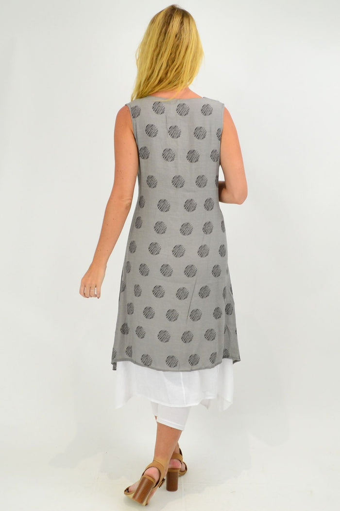 Sleeveless grey dots overlay tunic dress by La Mode featuring a relaxed fit and stylish design, displayed on a hanger.