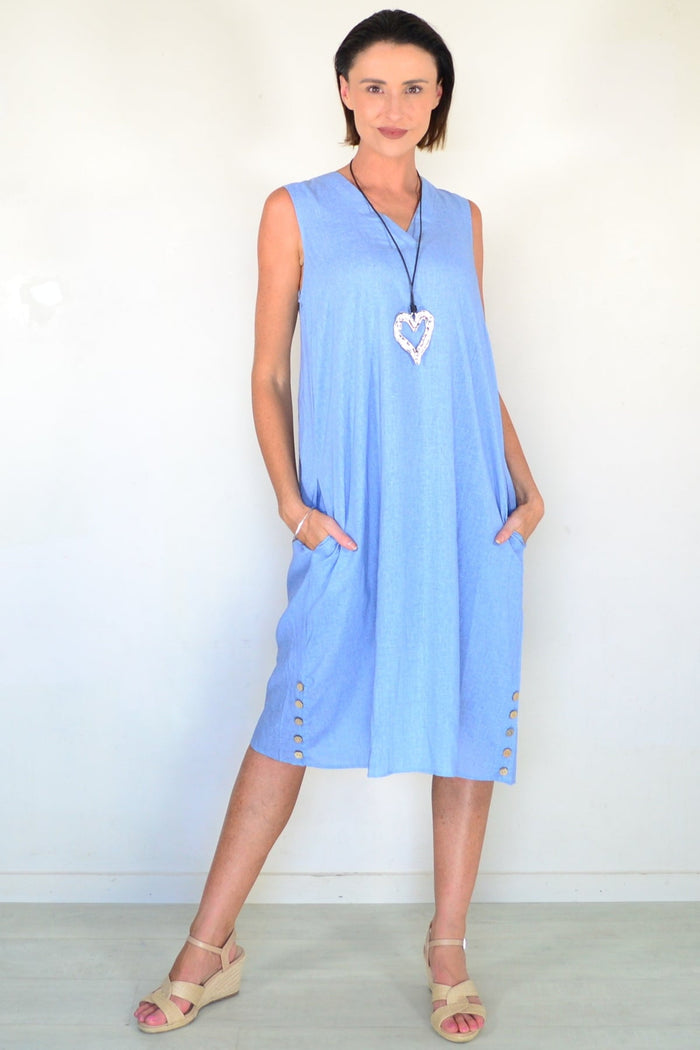 Light blue sleeveless tunic dress by Willow Tree, flowing fabric, relaxed fit, and sleeveless design displayed on a hanger.