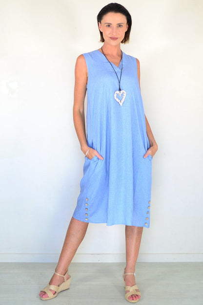 Light blue sleeveless tunic dress by Willow Tree, flowing fabric, relaxed fit, and sleeveless design displayed on a hanger.