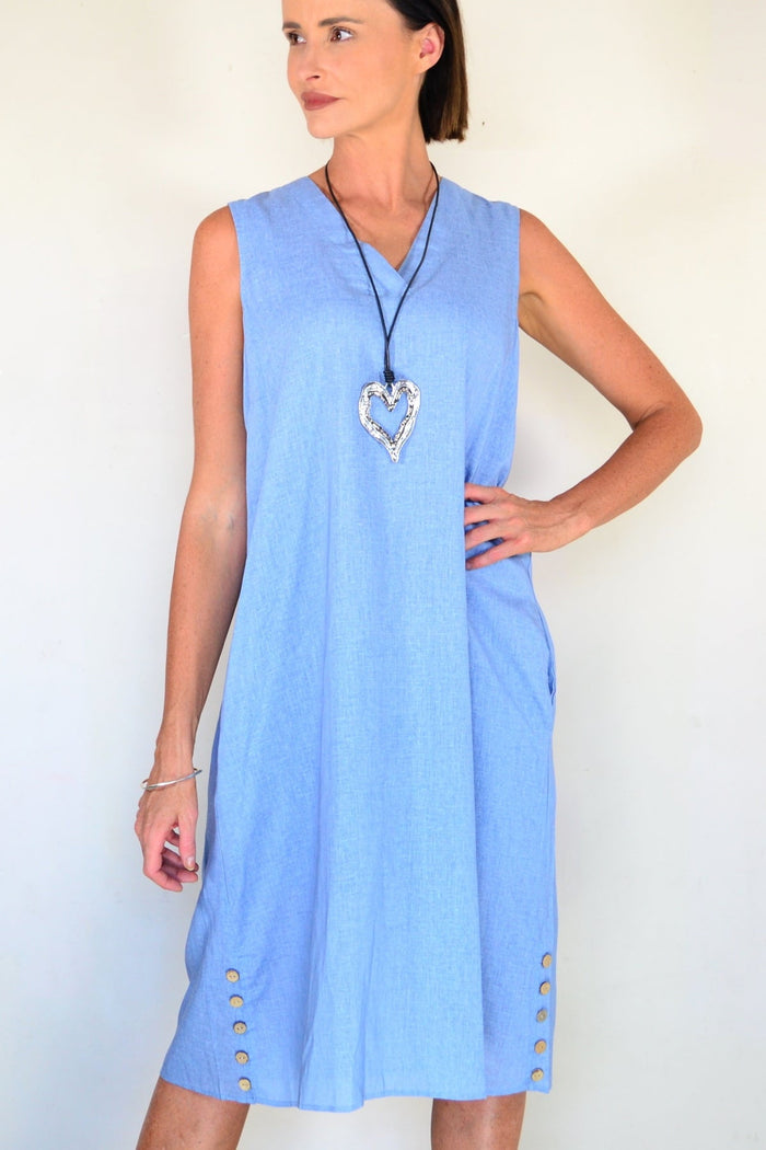 Light blue sleeveless tunic dress by Willow Tree, flowing fabric with a relaxed fit, displayed on a hanger.
