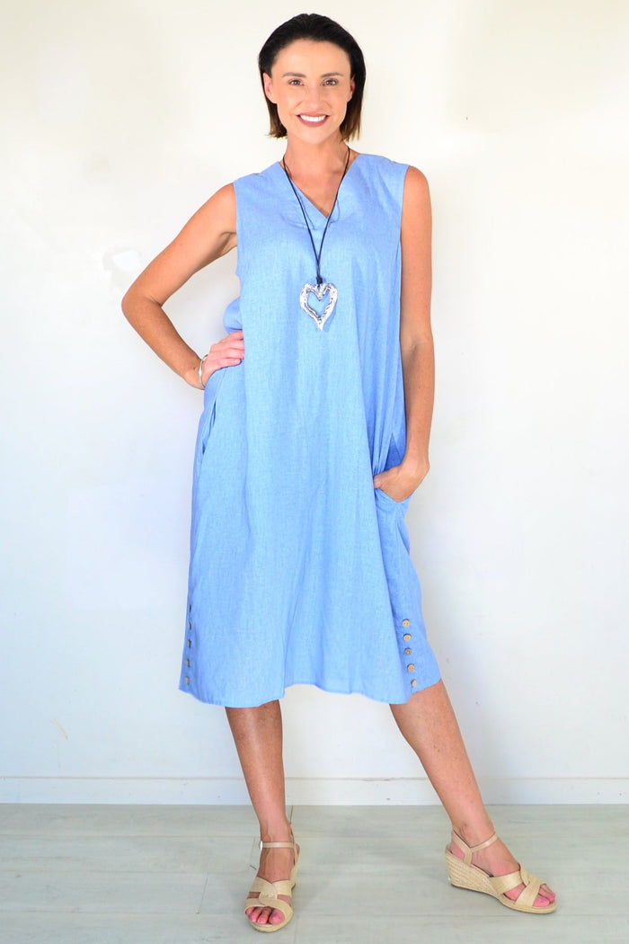 Light blue sleeveless tunic dress by Willow Tree, featuring a relaxed fit and simple round neckline, displayed on a hanger.