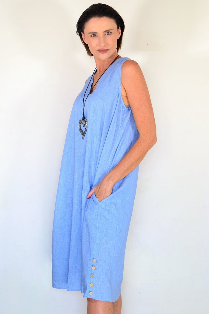 Light blue sleeveless tunic dress from Willow Tree, flowing fabric and simple design, hanging on a hanger.
