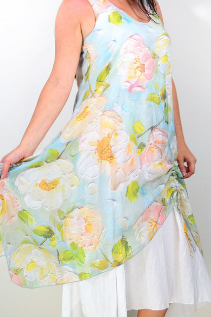Soft blue and pink floral sleeveless tunic dress by Cali&Co, featuring a relaxed fit and feminine floral pattern.