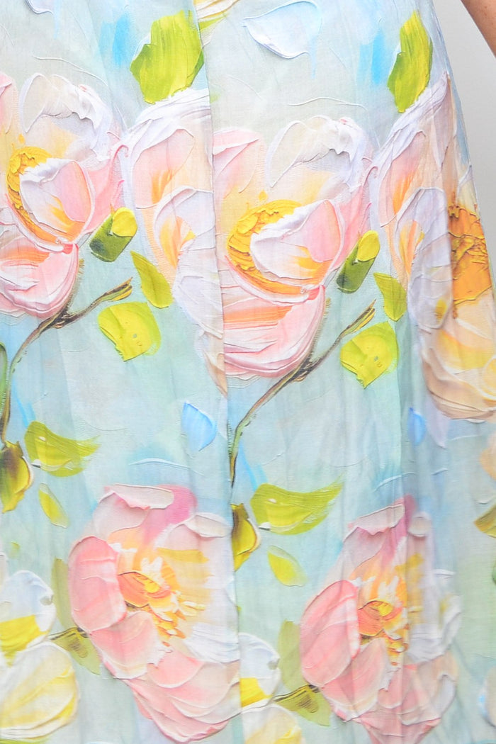 Soft blue and pink floral sleeveless tunic dress by Cali&Co, featuring a flowy fabric and vibrant floral pattern.