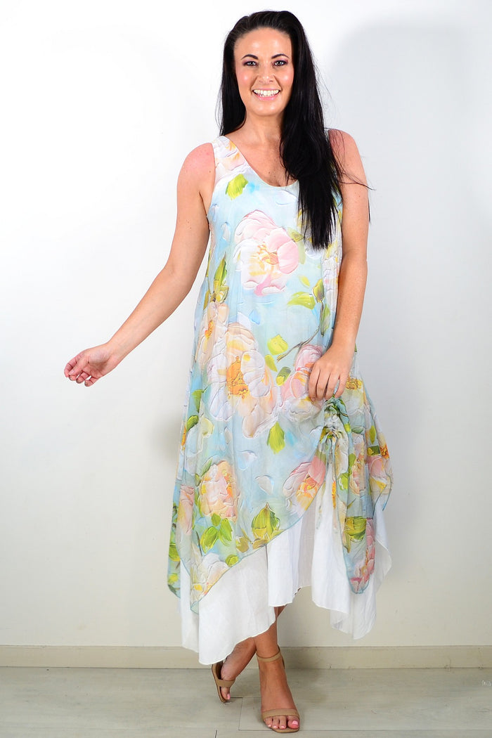 Soft blue and pink floral sleeveless tunic dress by Cali&Co, featuring a flowy design and vibrant floral pattern.