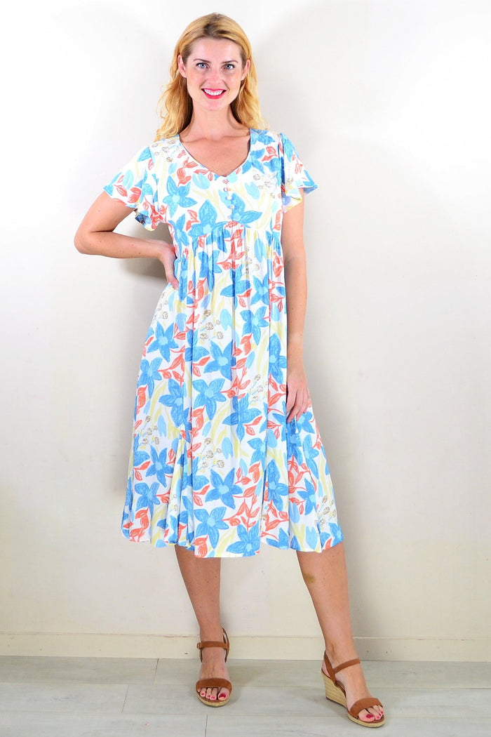 Soft garden floral tunic dress by Hourglass featuring a flowy fabric, floral pattern, and relaxed fit for casual wear.