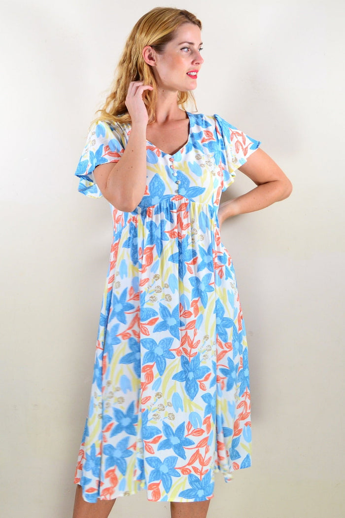 Soft garden floral tunic dress by Hourglass, showing lightweight fabric and vibrant floral pattern perfect for casual wear